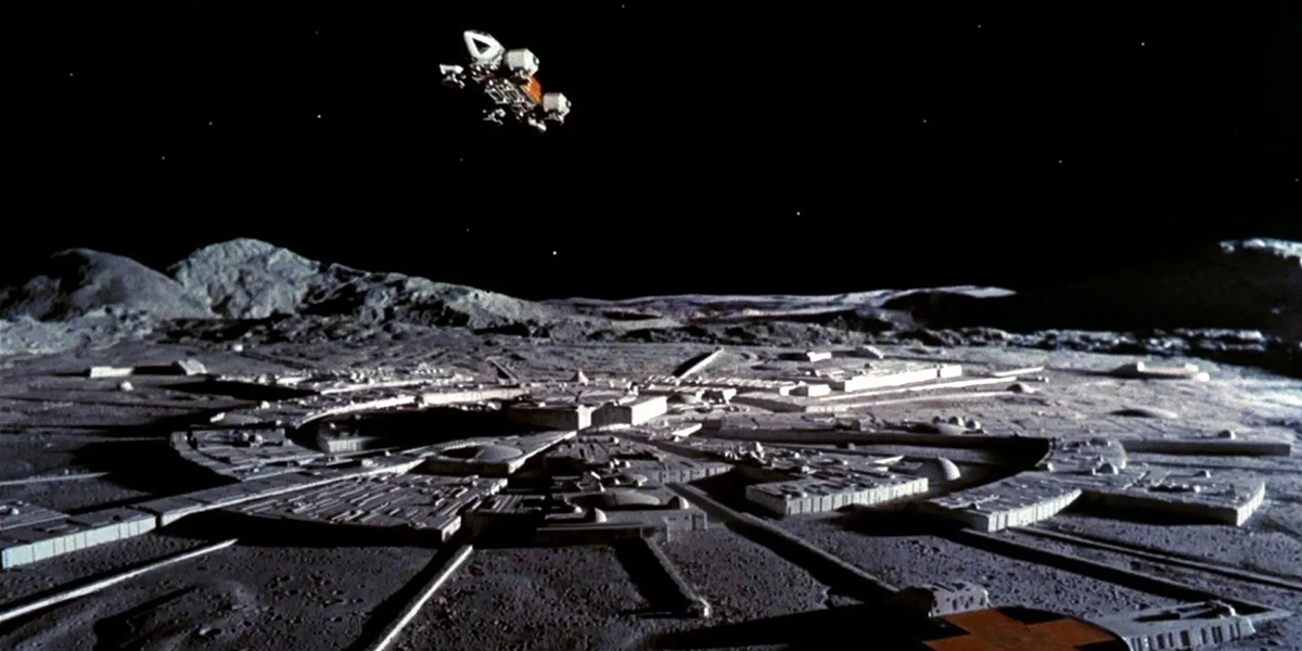 A picture of an Eagle Transporter flying over Moonbase Alpha